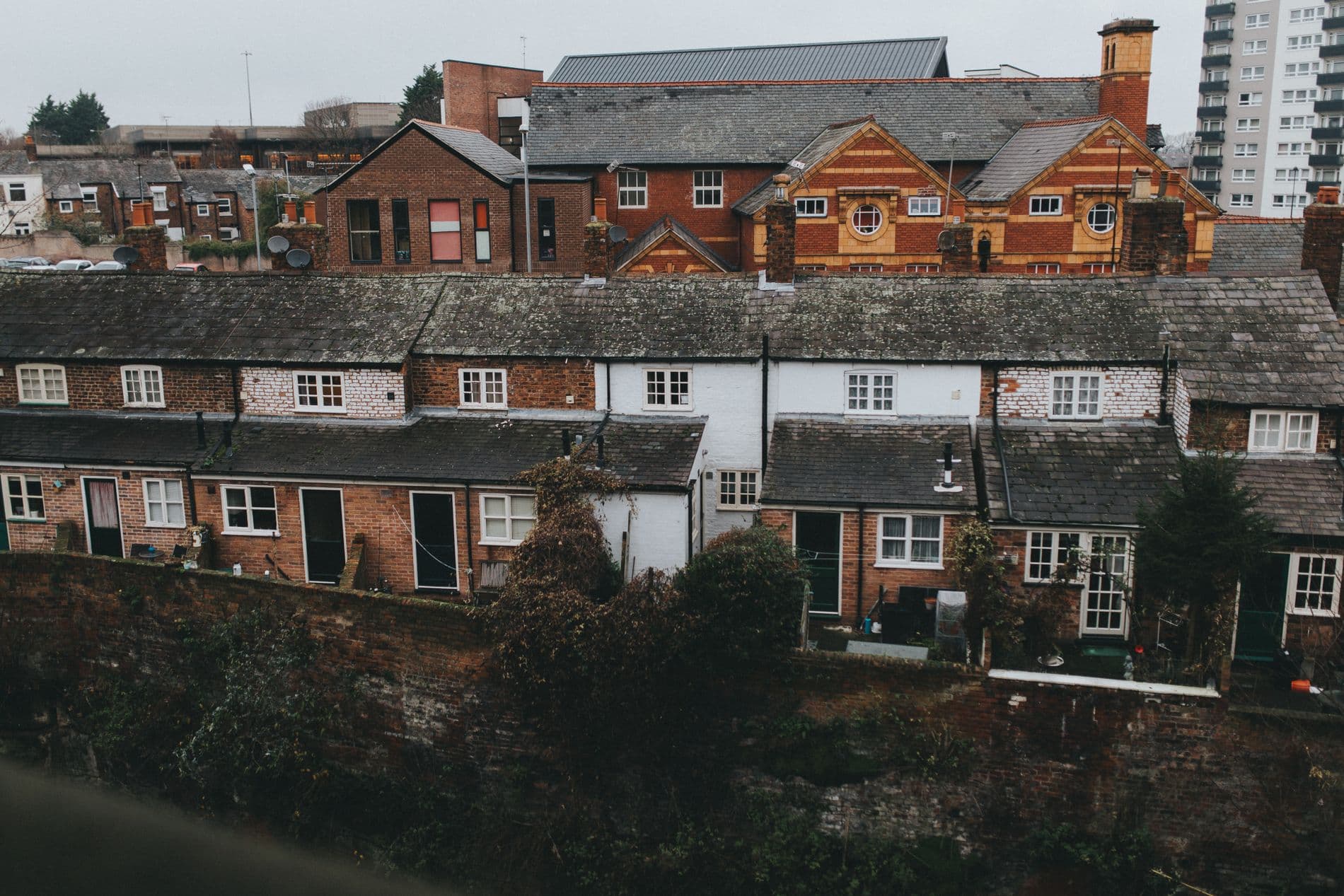 Red-brick house with a tiled roof and chimneys in the UK